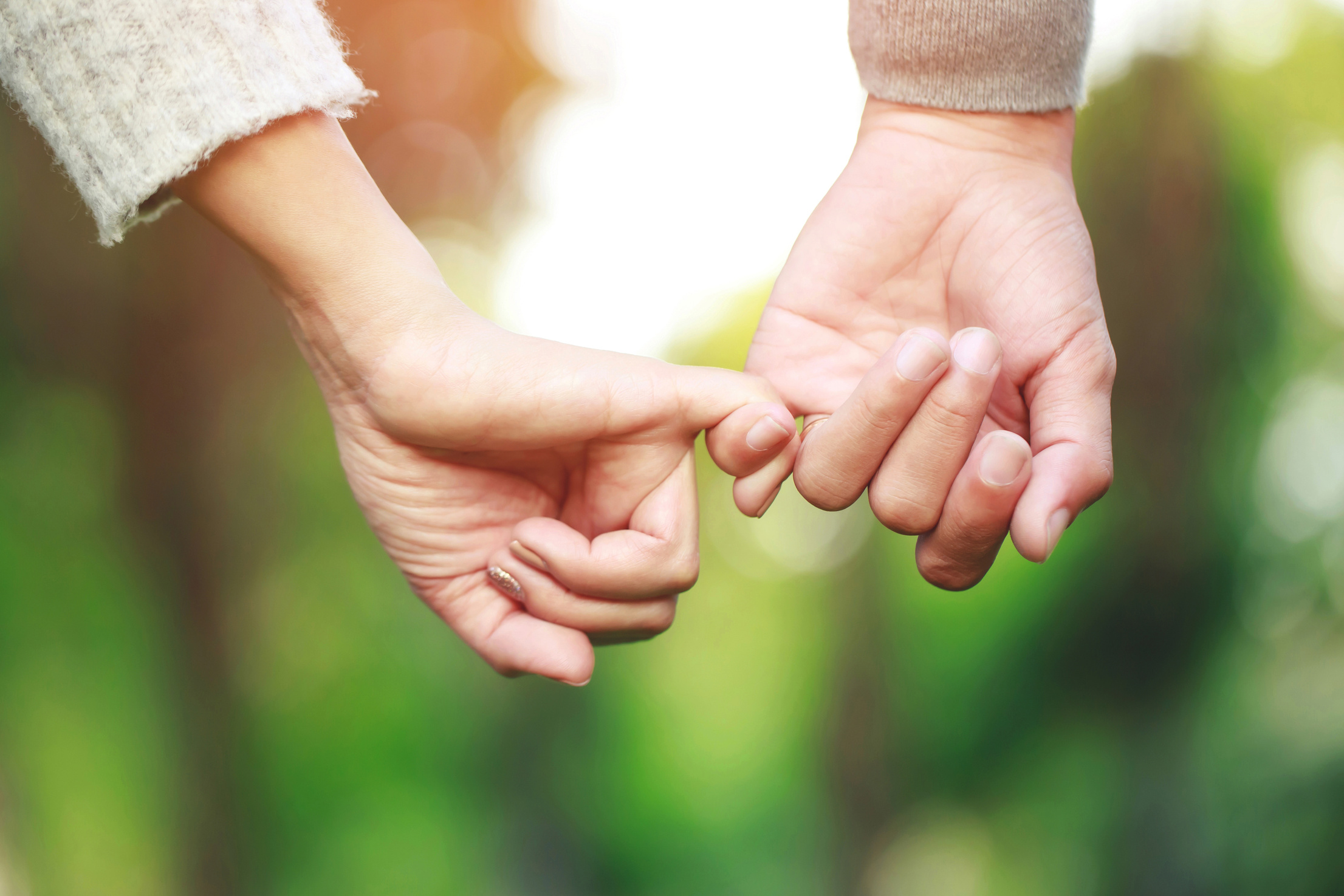 Couple Doing a Pinky Promise Hand Gesture 